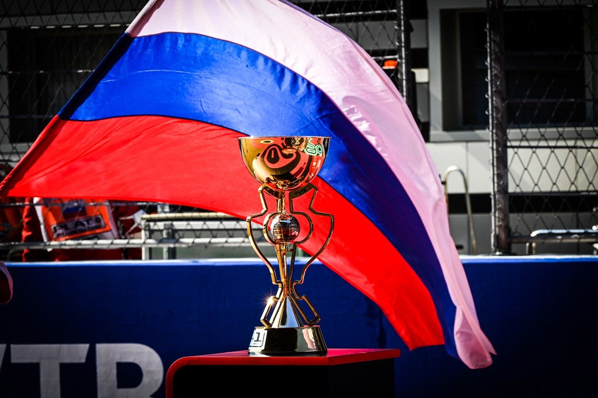 the-trophy-and-a-russian-flag-